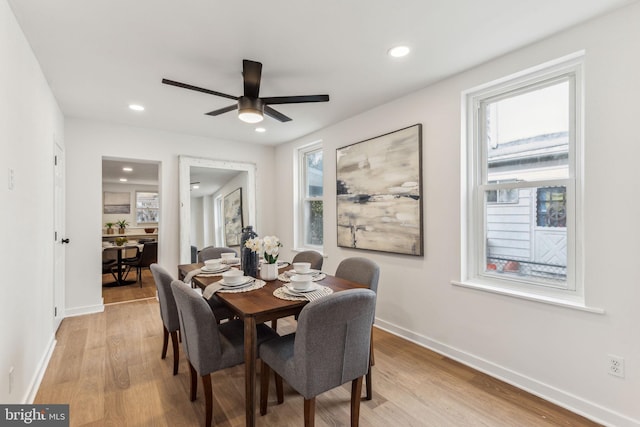 dining space with recessed lighting, ceiling fan, light wood-style flooring, and baseboards