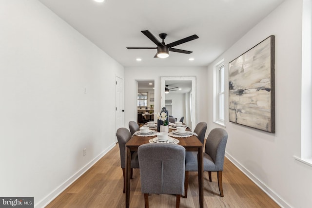 dining area with a ceiling fan, recessed lighting, baseboards, and wood finished floors