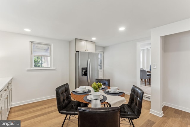 dining room featuring recessed lighting, baseboards, and light wood finished floors