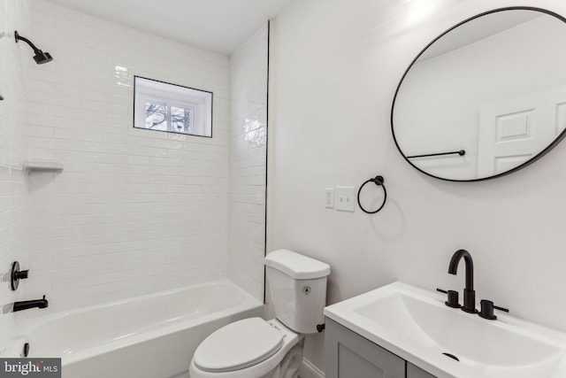 bathroom featuring toilet,  shower combination, and vanity