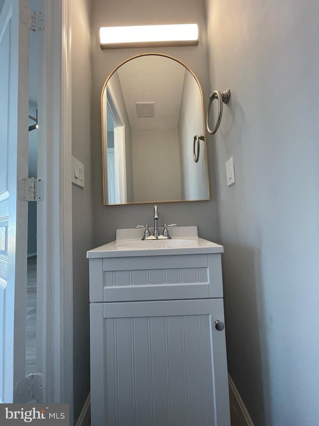 bathroom with vanity and baseboards