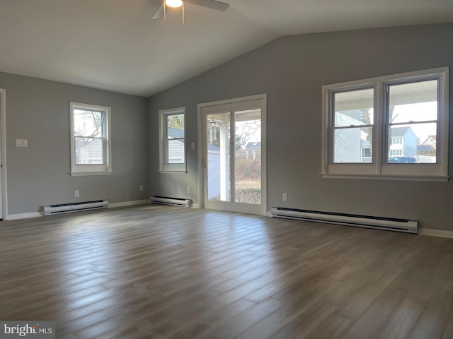 spare room with a baseboard heating unit and light wood-style flooring