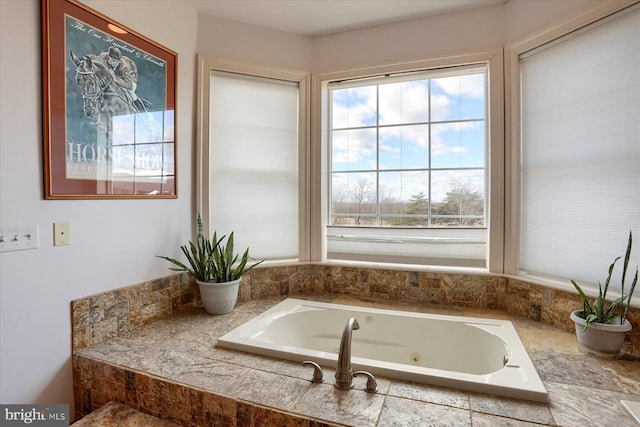 full bath featuring a whirlpool tub