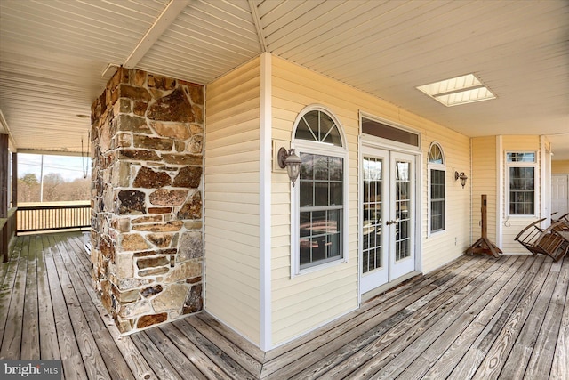 wooden terrace featuring french doors