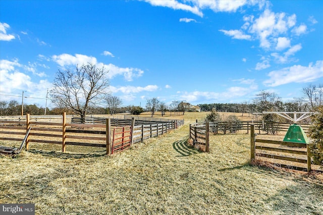 view of yard featuring a rural view and fence