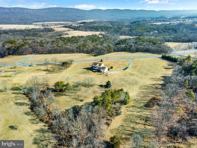 birds eye view of property with a mountain view and a rural view