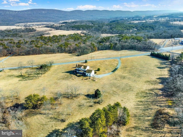 drone / aerial view featuring a rural view and a mountain view