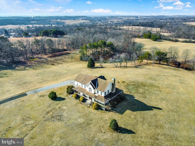 birds eye view of property with a rural view