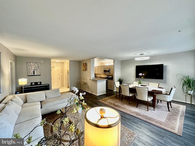 living room featuring dark wood-style floors and baseboards