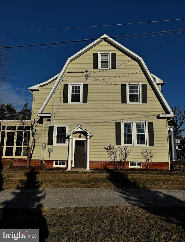 dutch colonial featuring a gambrel roof