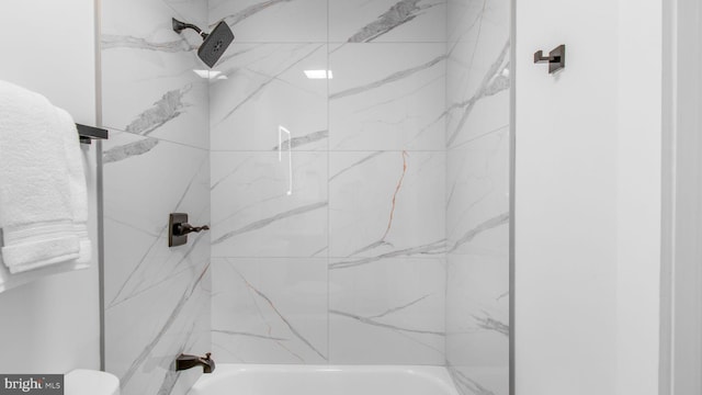 bathroom featuring toilet and tub / shower combination