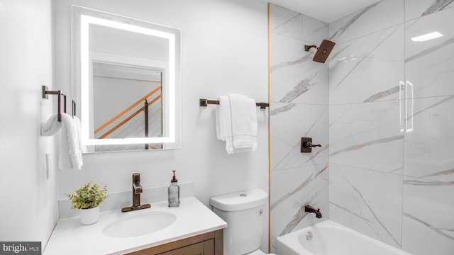 bathroom featuring tub / shower combination, toilet, and vanity
