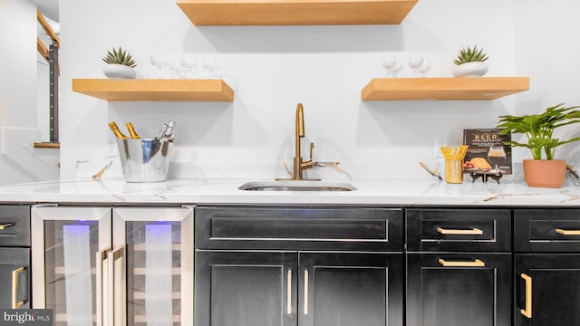 bar with wine cooler, a sink, and indoor wet bar
