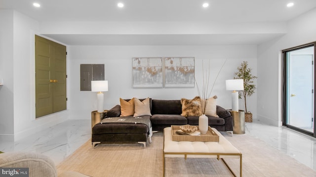 living room featuring recessed lighting, electric panel, marble finish floor, and baseboards
