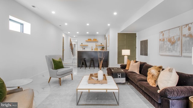 living room featuring marble finish floor, electric panel, visible vents, and recessed lighting