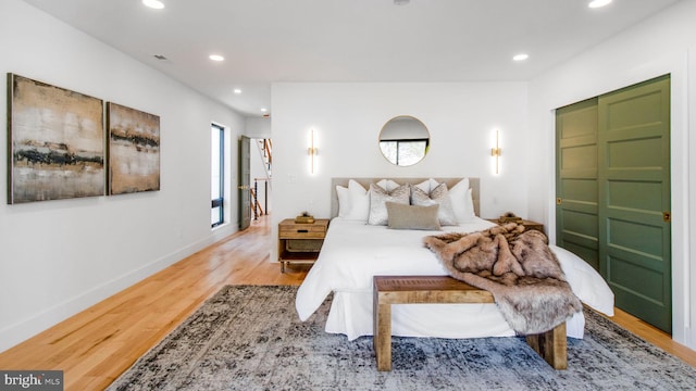 bedroom featuring recessed lighting, wood finished floors, and baseboards