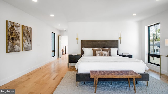 bedroom featuring light wood-type flooring, baseboards, and recessed lighting