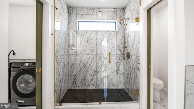 full bathroom with toilet, a marble finish shower, and washer / clothes dryer