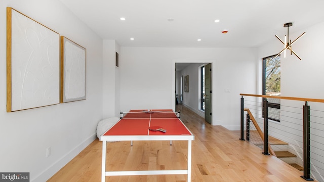 rec room featuring recessed lighting, light wood-style flooring, visible vents, and baseboards
