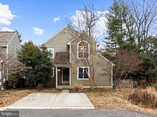 traditional-style house with fence