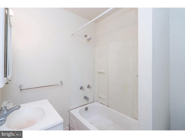 bathroom featuring bathtub / shower combination and a sink