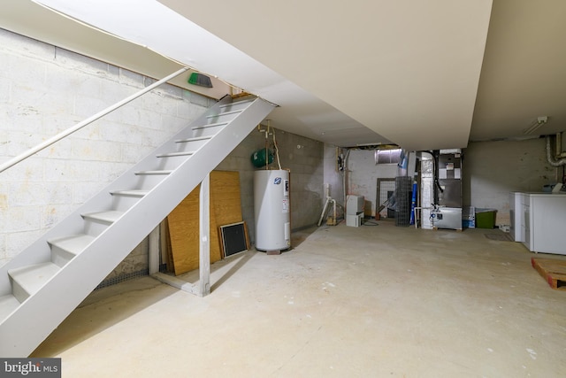 unfinished basement with heating unit, electric water heater, and stairs