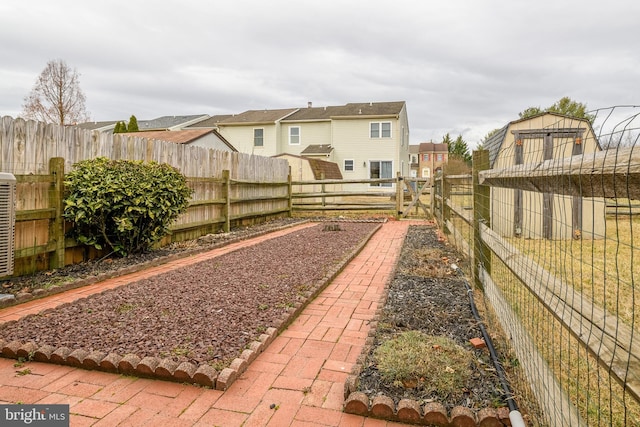 view of yard with a residential view and a fenced backyard