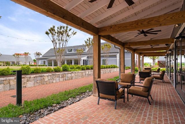 view of patio / terrace featuring ceiling fan and a residential view