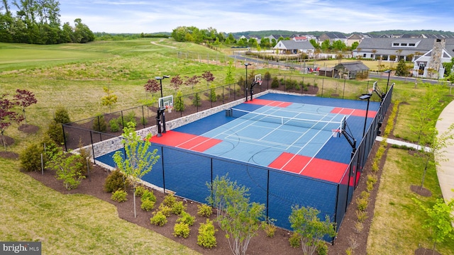 exterior space featuring a tennis court, community basketball court, and fence