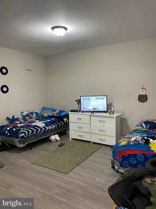 bedroom with light wood-style floors