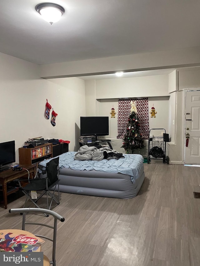 bedroom with wood finished floors