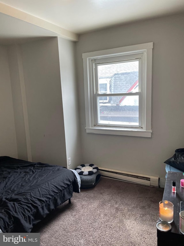 bedroom featuring carpet floors and a baseboard heating unit