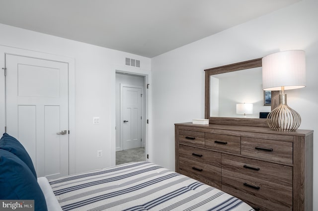 bedroom with carpet floors and visible vents