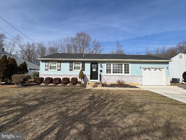 single story home featuring brick siding, concrete driveway, an attached garage, entry steps, and a front yard