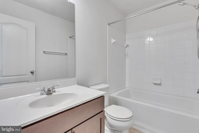 full bathroom featuring toilet, bathing tub / shower combination, and vanity