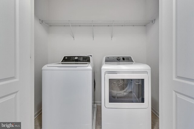 laundry area with laundry area and independent washer and dryer