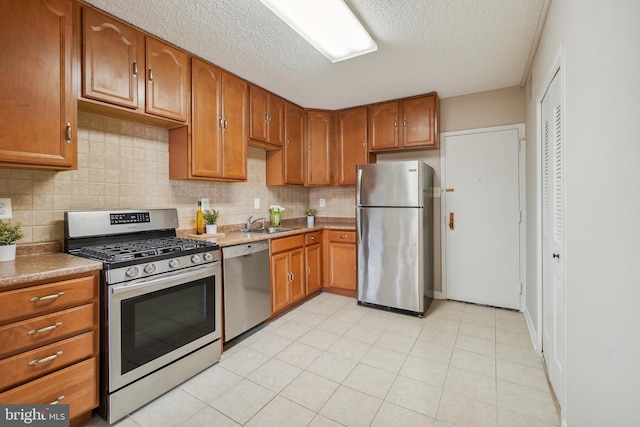 kitchen featuring decorative backsplash, brown cabinets, and stainless steel appliances