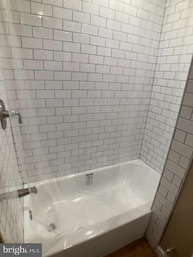 full bath featuring  shower combination