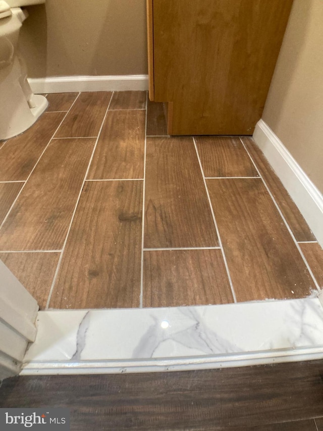 interior details with wood tiled floor and baseboards