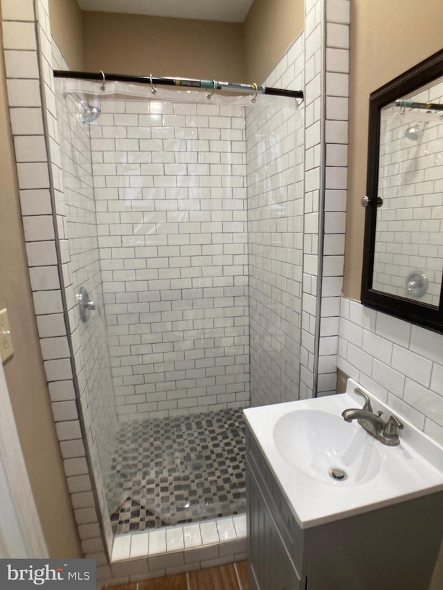 full bathroom featuring a shower stall