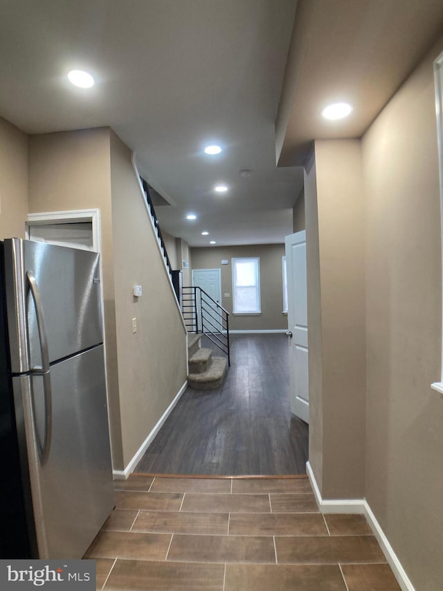 hall with baseboards, stairway, recessed lighting, and wood tiled floor