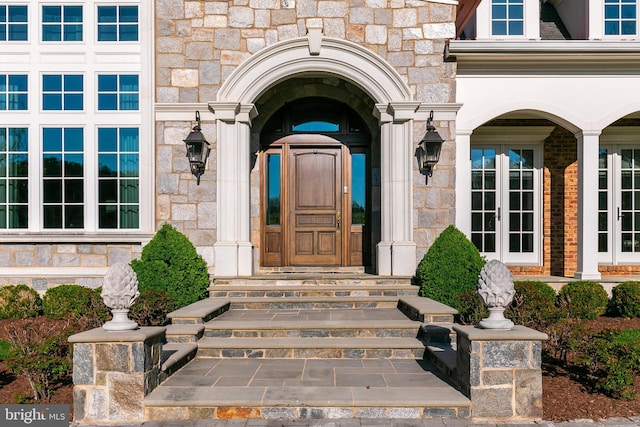 22577 Creighton Farms Dr, Leesburg, VA 20175 - view of exterior entry featuring french doors and stone siding