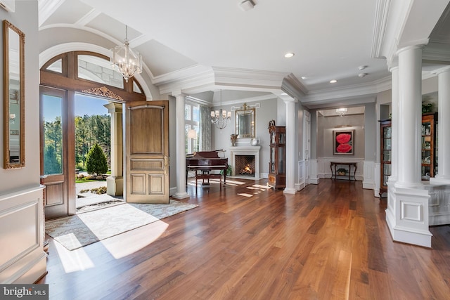 22577 Creighton Farms Dr, Leesburg, VA 20175 - entrance foyer featuring recessed lighting, a notable chandelier, ornate columns, and wood finished floors