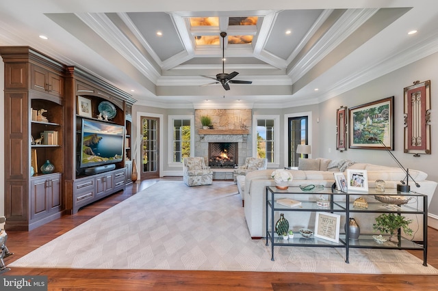 22577 Creighton Farms Dr, Leesburg, VA 20175 - living area with ornamental molding, ceiling fan, wood finished floors, and a high end fireplace