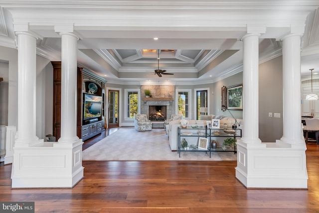 22577 Creighton Farms Dr, Leesburg, VA 20175 - living room with a large fireplace, ornamental molding, a ceiling fan, and wood finished floors