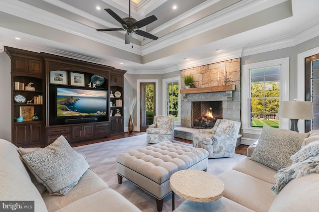 22577 Creighton Farms Dr, Leesburg, VA 20175 - living room with crown molding, light wood-style floors, a fireplace, a ceiling fan, and recessed lighting