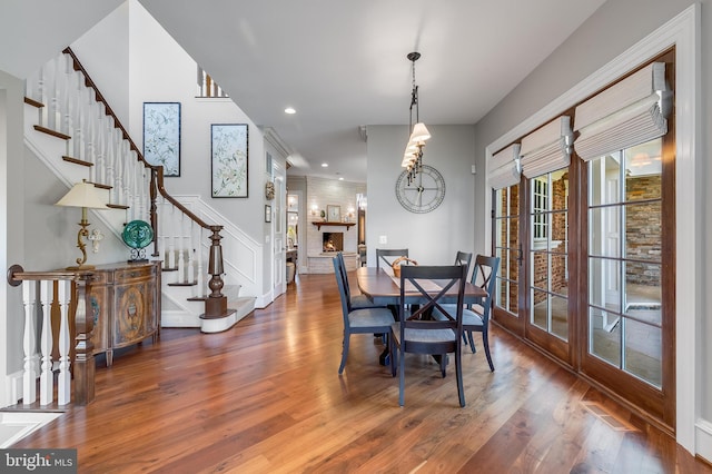 22577 Creighton Farms Dr, Leesburg, VA 20175 - dining room with recessed lighting, stairway, wainscoting, visible vents, and wood finished floors