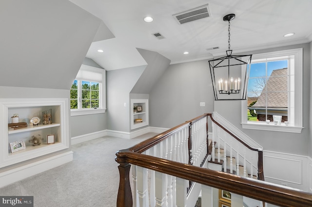 22577 Creighton Farms Dr, Leesburg, VA 20175 - stairs featuring visible vents, built in features, an inviting chandelier, and carpet floors