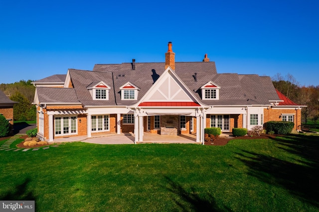 22577 Creighton Farms Dr, Leesburg, VA 20175 - rear view of house with french doors, a patio area, and a yard