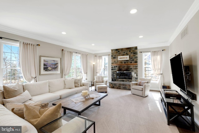 living room featuring recessed lighting, light colored carpet, a fireplace, visible vents, and crown molding